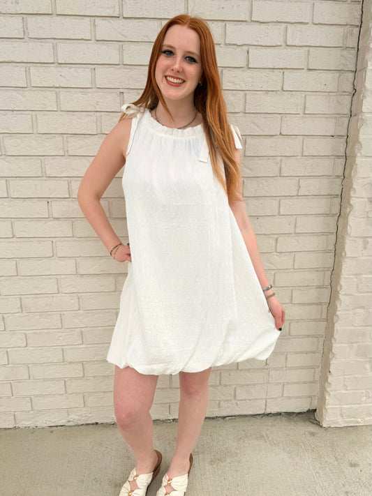 sleeveless mock neck dress with ribbon and ruffles