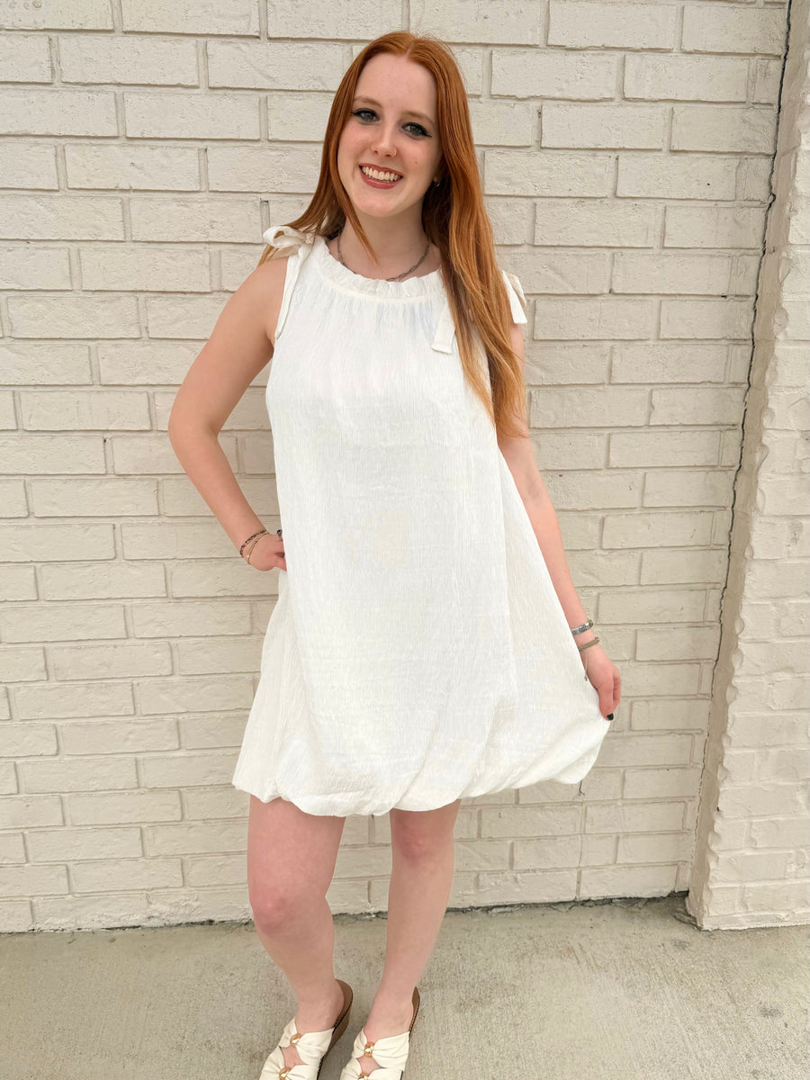 sleeveless mock neck dress with ribbon and ruffles
