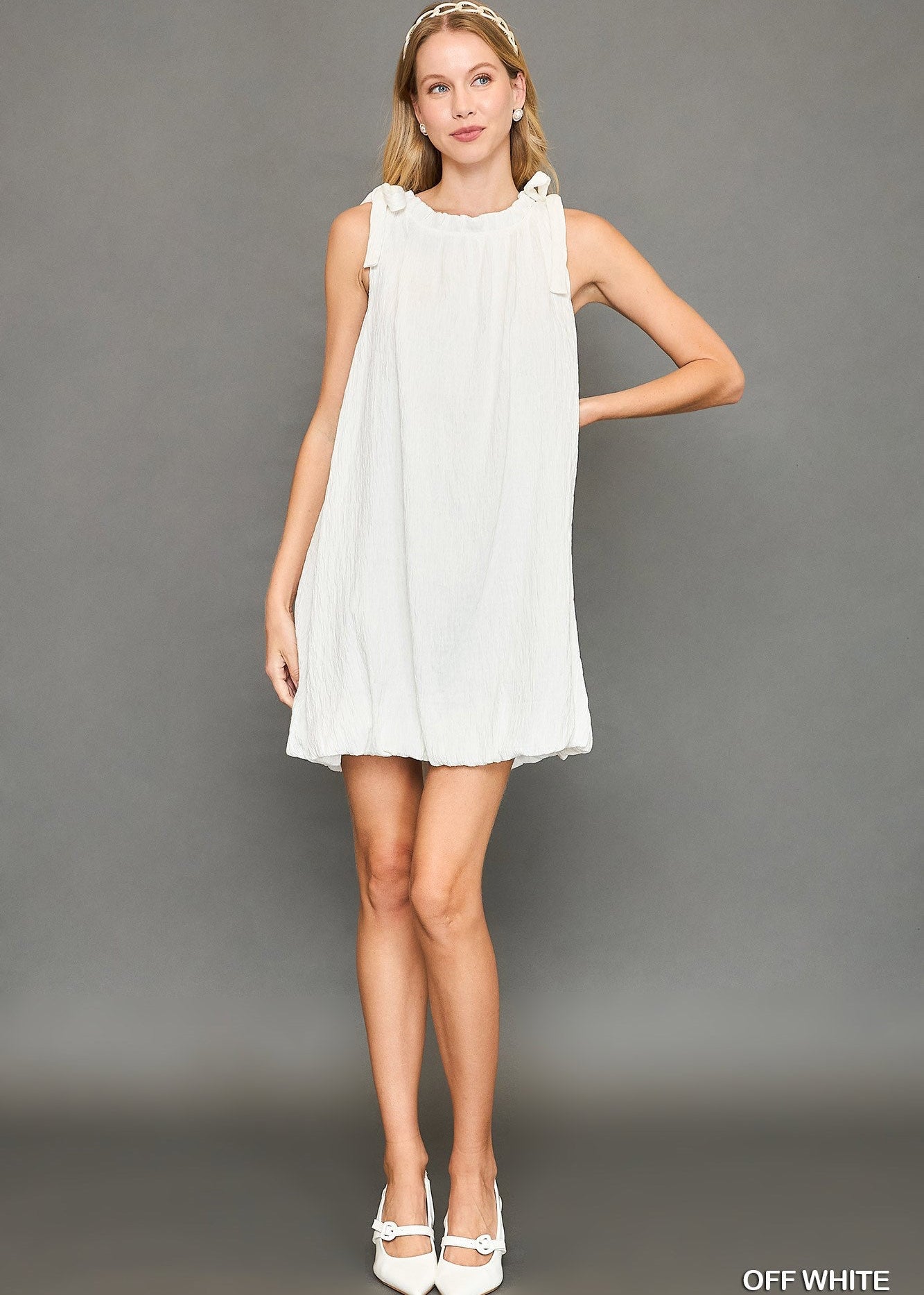 sleeveless mock neck dress with ribbon and ruffles
