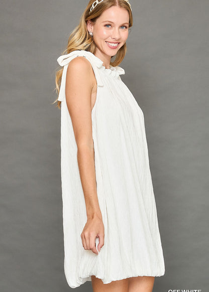 sleeveless mock neck dress with ribbon and ruffles