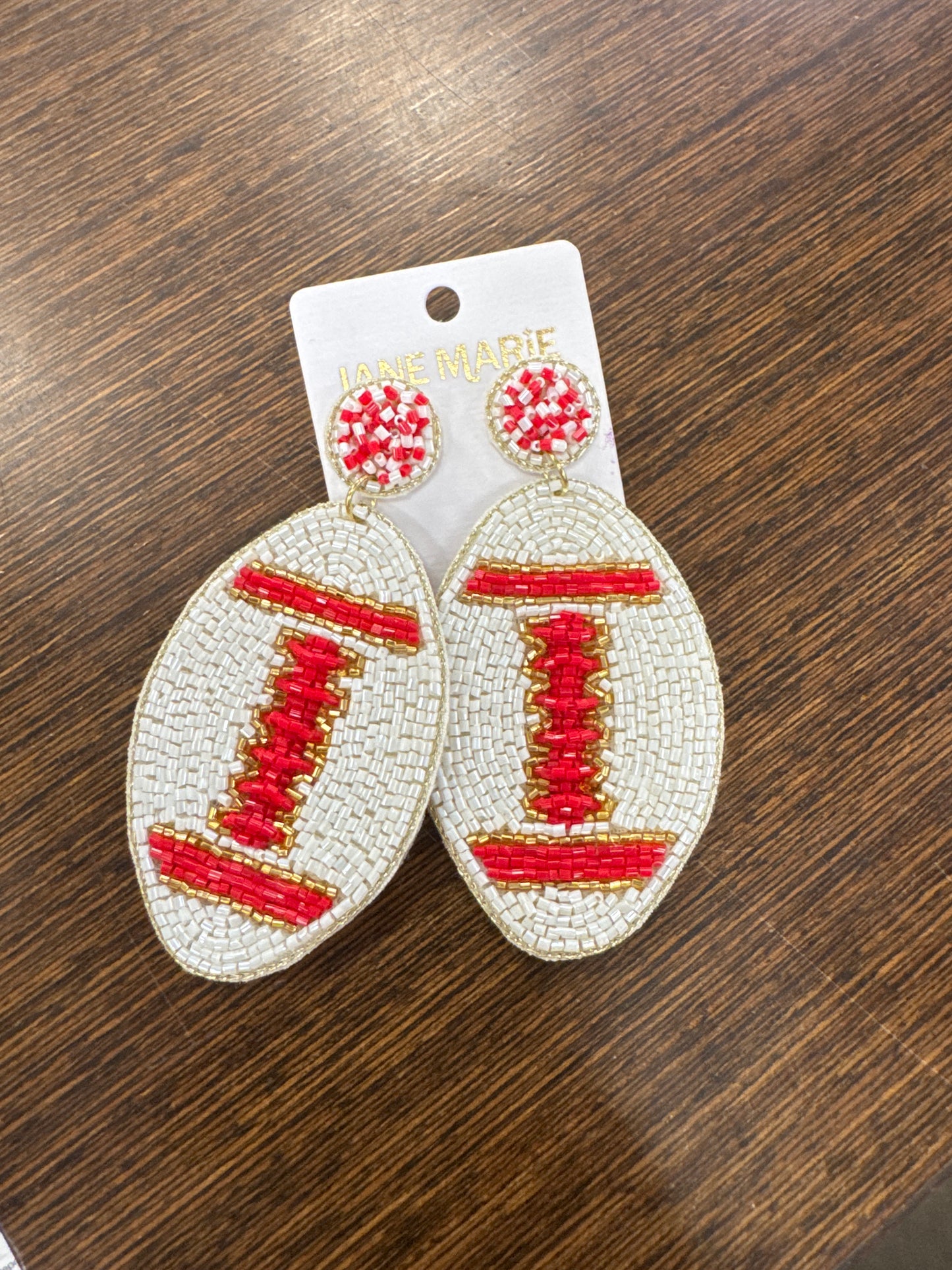 White and red football earrings