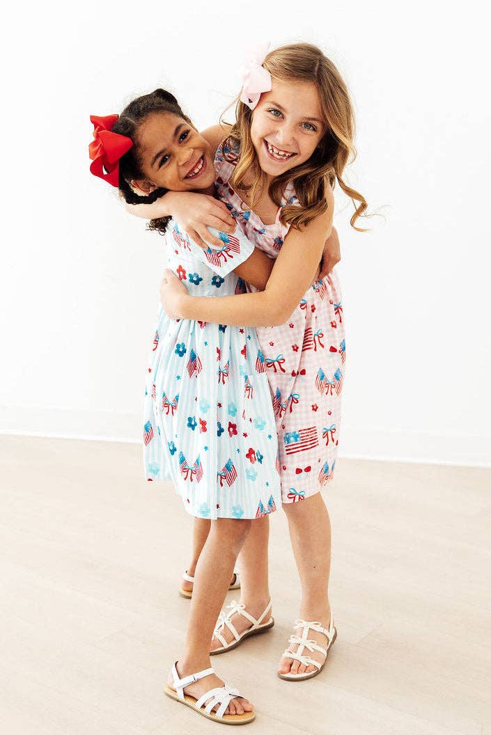Mila & Rose - Fancy Flags Ruffle Cross Back Dress