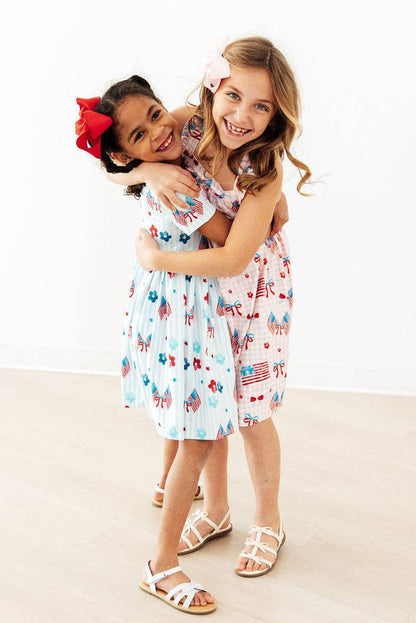 Mila & Rose - Fancy Flags Ruffle Cross Back Dress