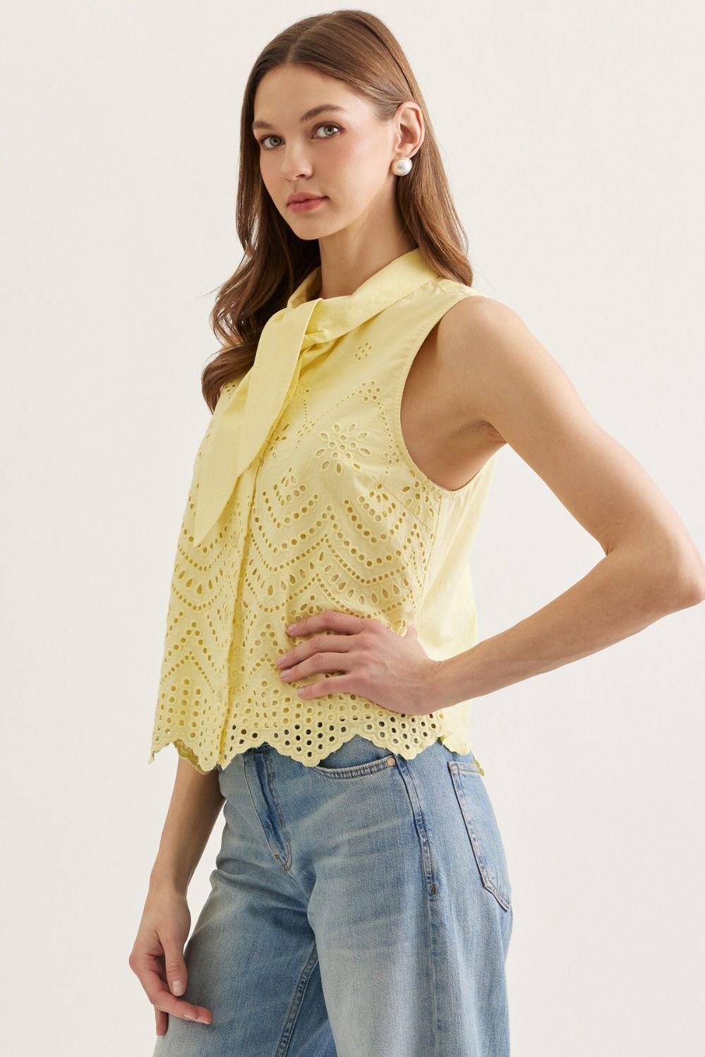 Lemon sleeveless top featuring eyelet embroidery detail